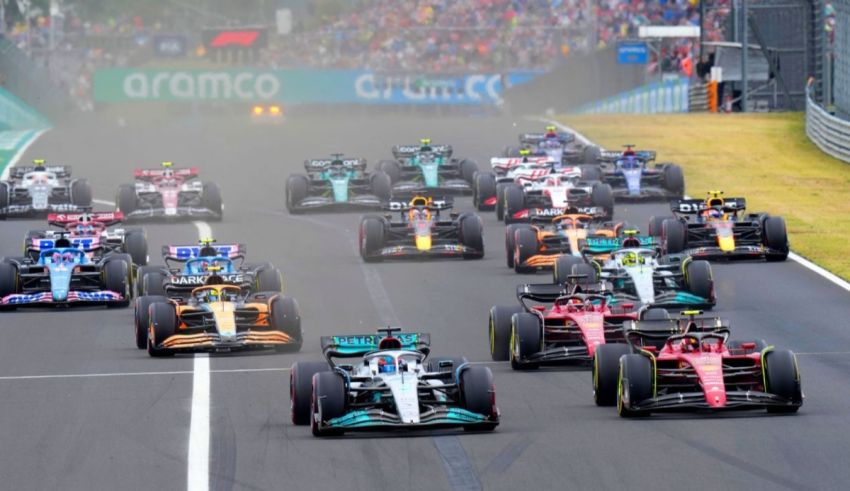 A group of racing cars on a race track.