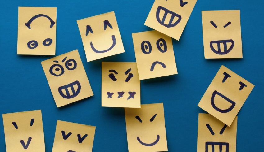 A group of yellow sticky notes with smiley faces on them.