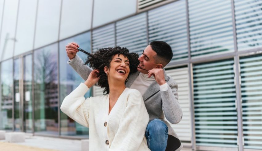 A man holding a woman on her back.