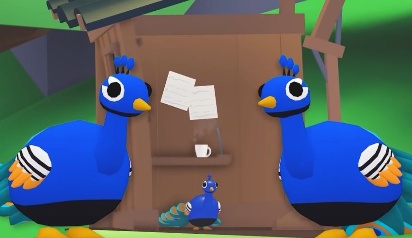 Two blue peacocks standing in front of a house.