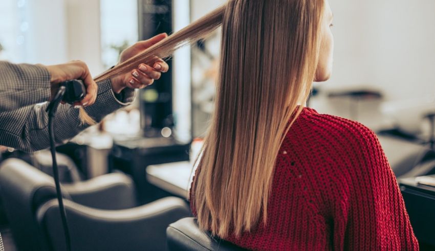 A woman getting her hair done in a salon.