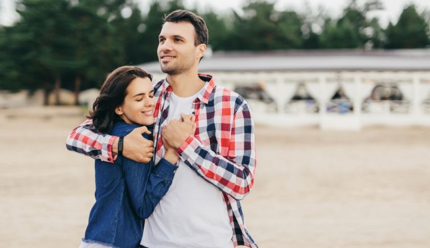 Young couple hugging on the beach.