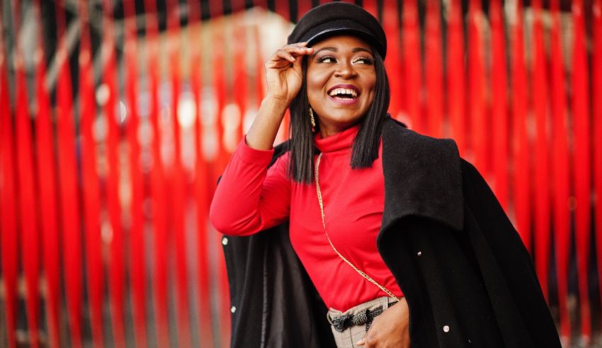 A woman wearing a red coat and hat.