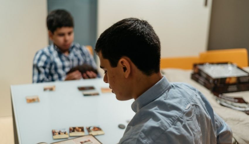 A man sitting at a table with a group of people.