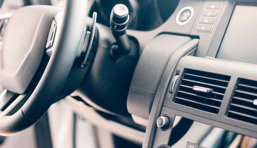 A close up of the steering wheel of a car.
