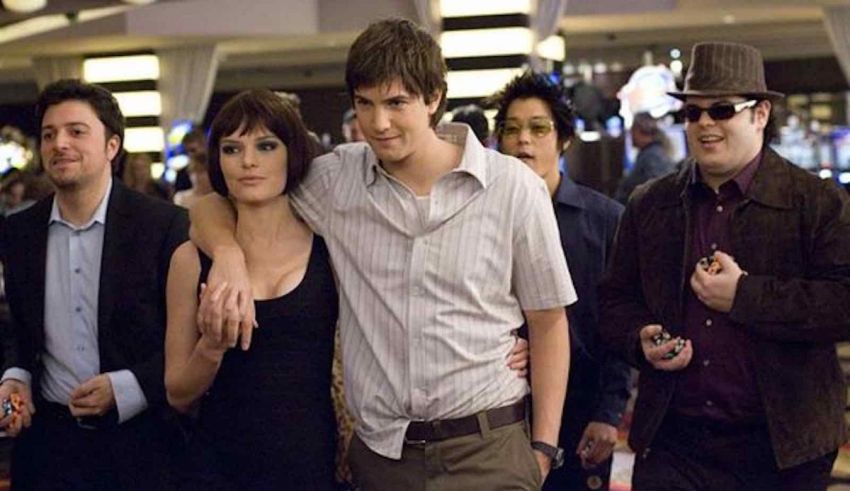 A group of people posing for a picture in a casino.