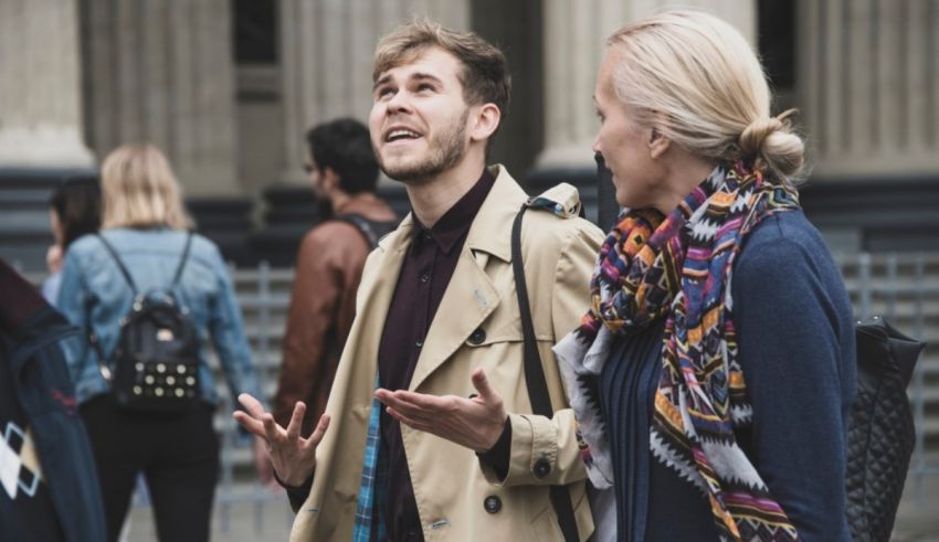 Two people talking to each other in a city.