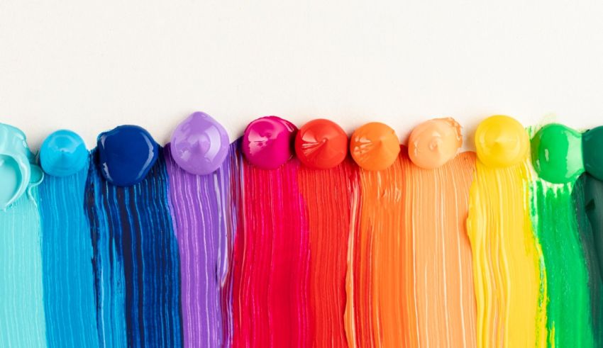 Colorful paint splatters on a white background.