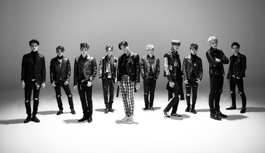 A group of korean boys posing for a photo.