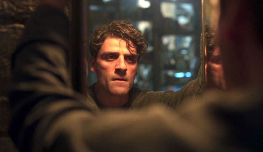 A man looking at himself in a mirror.