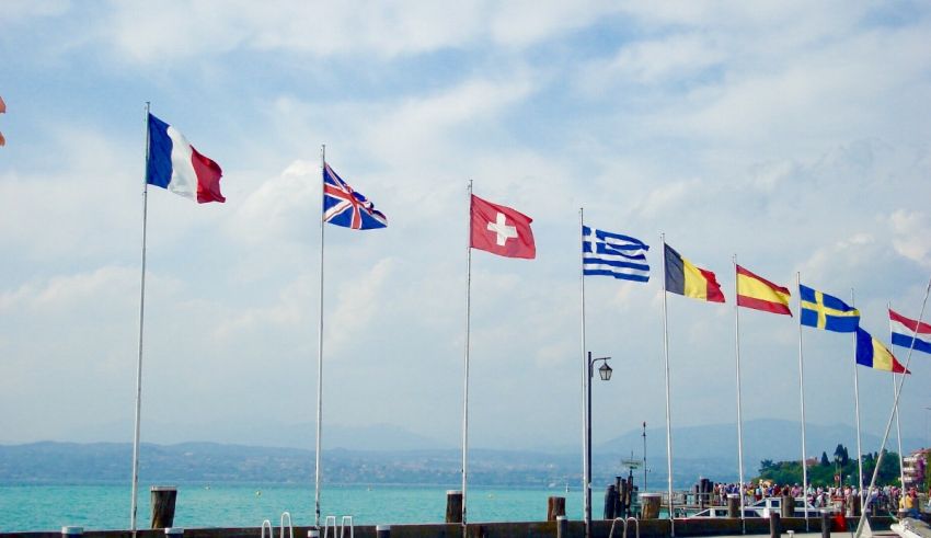 A group of flags fluttering in the wind.