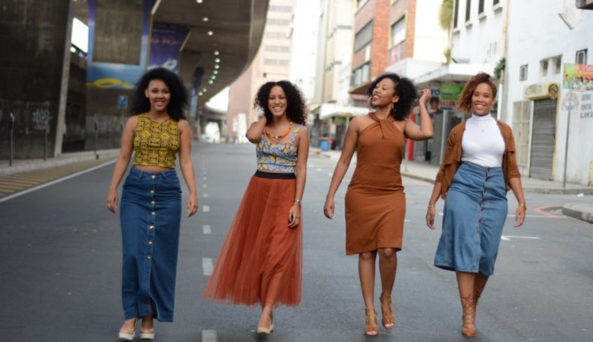 A group of women walking down a street.