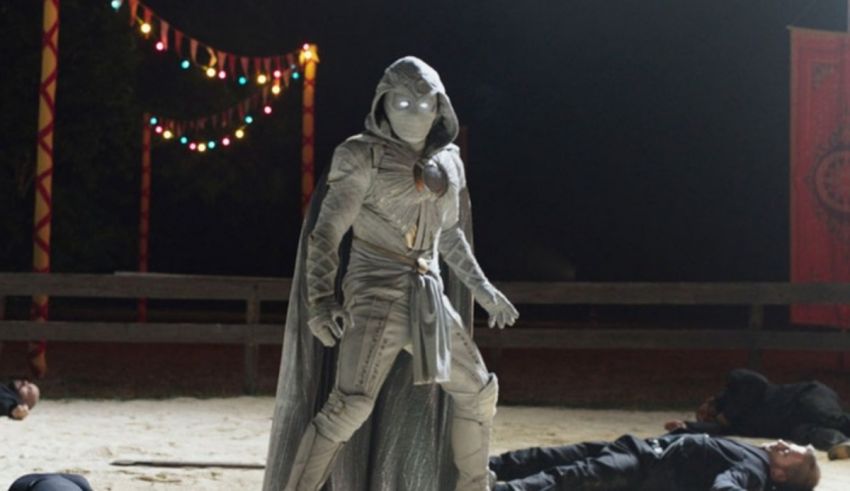 A man in a costume is laying on the ground.