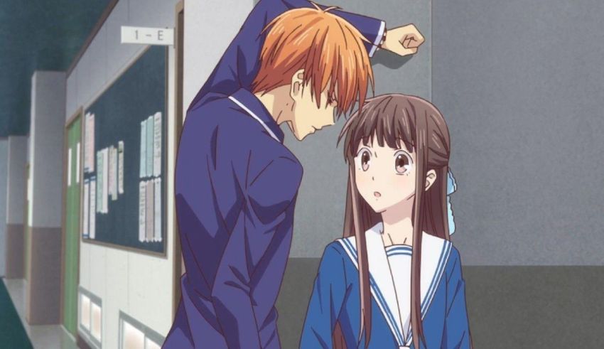 A boy and a girl standing in a hallway.