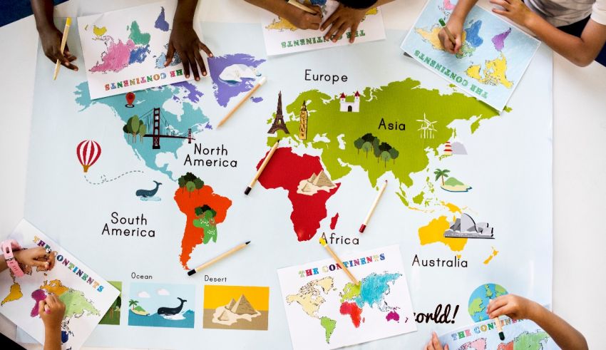 A group of children are working on a world map.