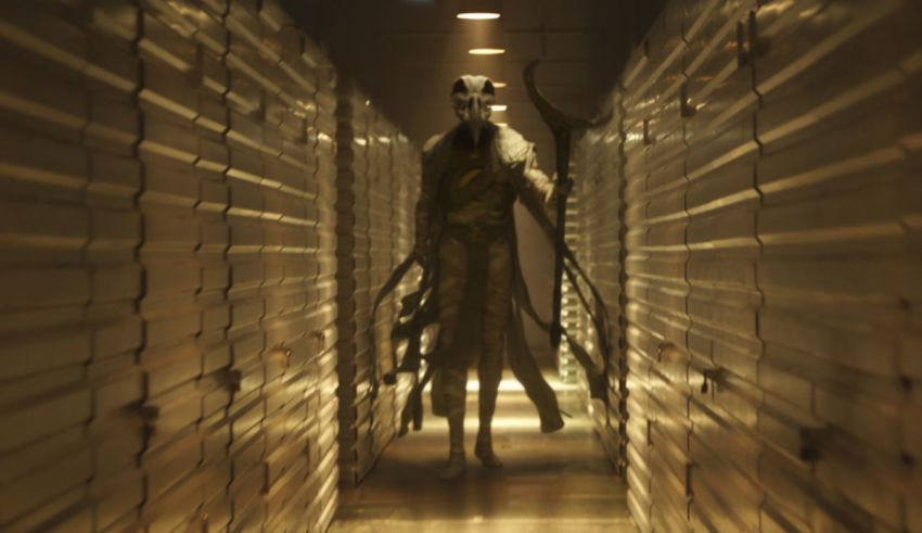 An image of a man walking down a hallway.