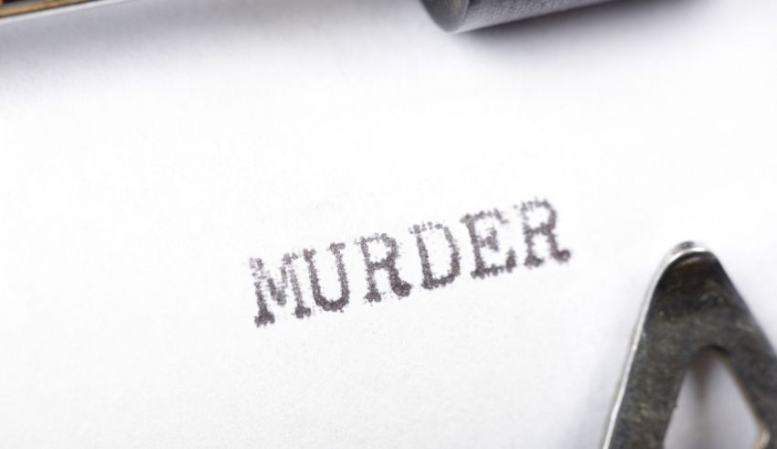 A typewriter with the word murder written on it.