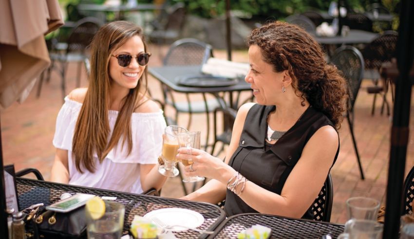 A couple of women sitting at a table.