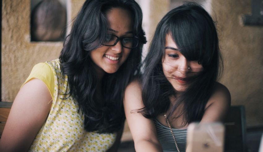 Two women looking at a computer screen.