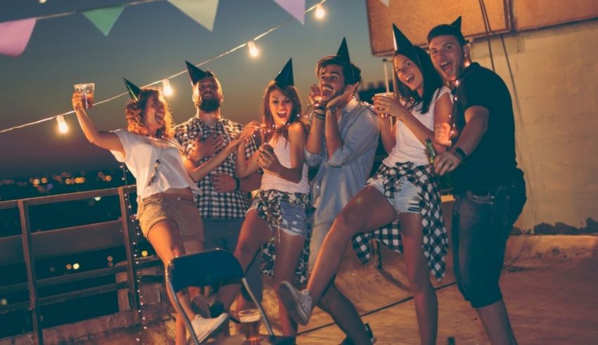 A group of friends having a party on a rooftop.