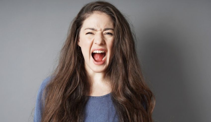 A woman yelling with her mouth open.
