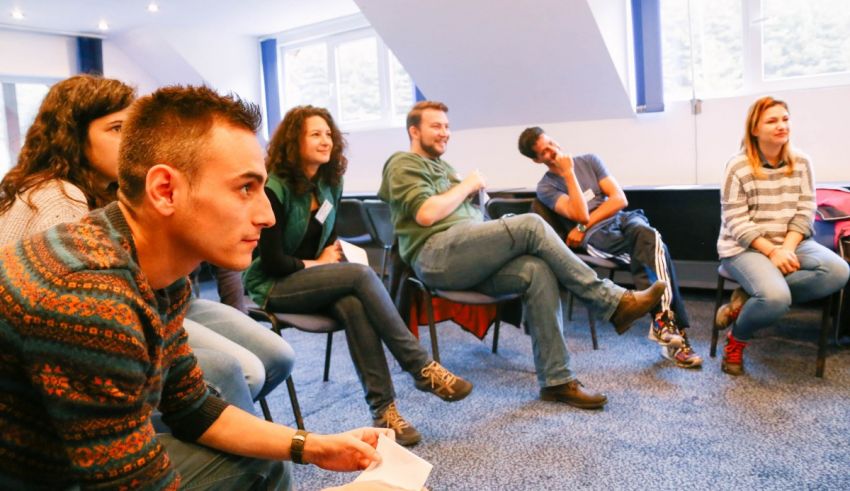 A group of people sitting in a room.