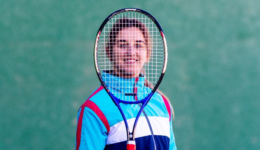 A woman holding a tennis racket.
