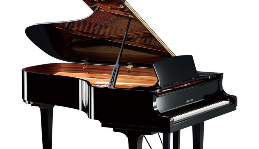 A black grand piano on a white background.