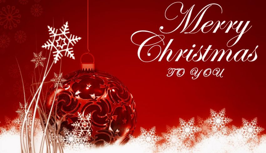 A merry christmas card with snowflakes and a red ball.