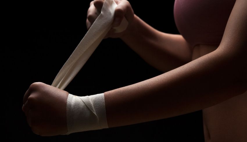 A woman with a bandage on her wrist.