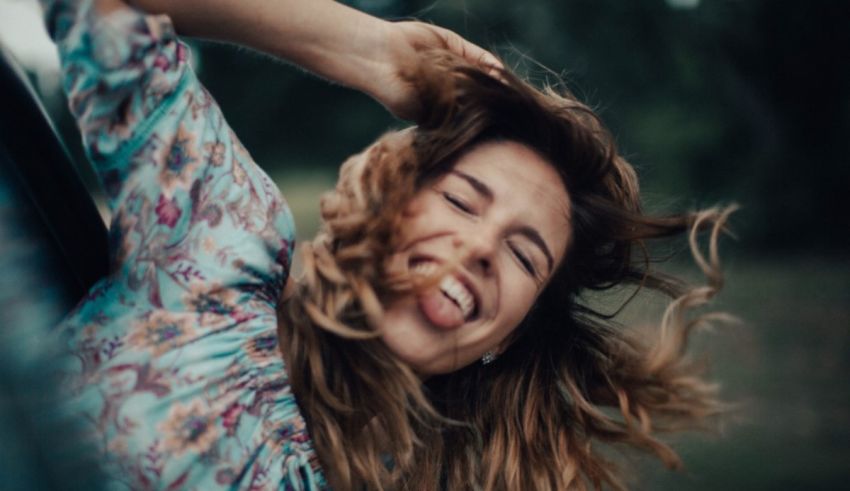 A woman with her hair blowing in the wind.