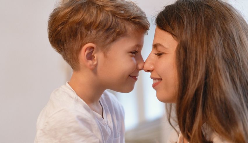 A mother and her son are looking at each other.