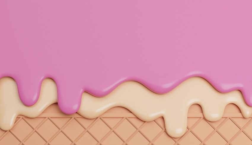 An ice cream cone with pink and white icing.