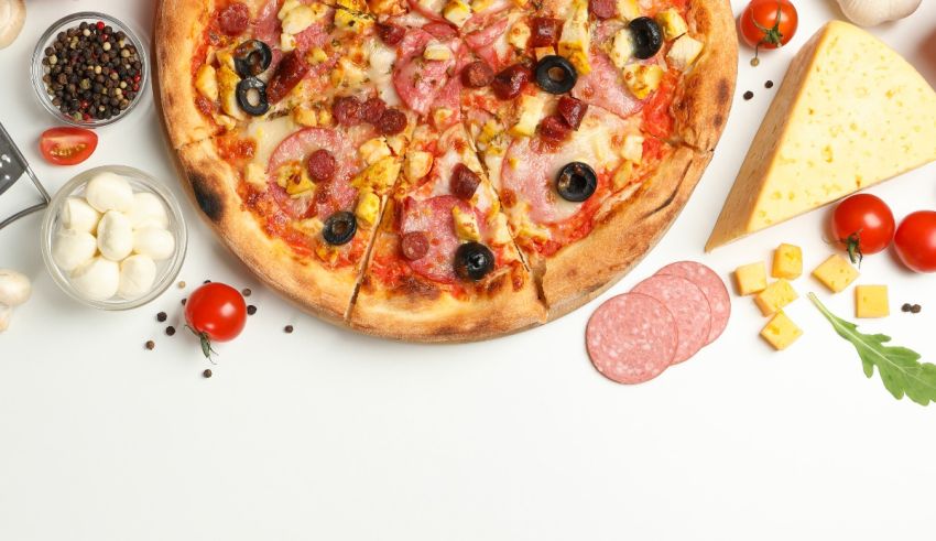 A pizza with various toppings on a white background.