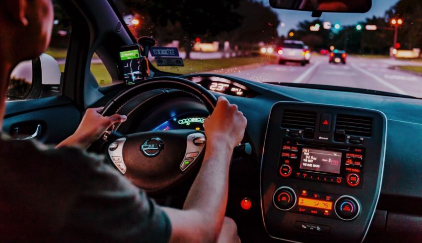 A man driving a car at night.