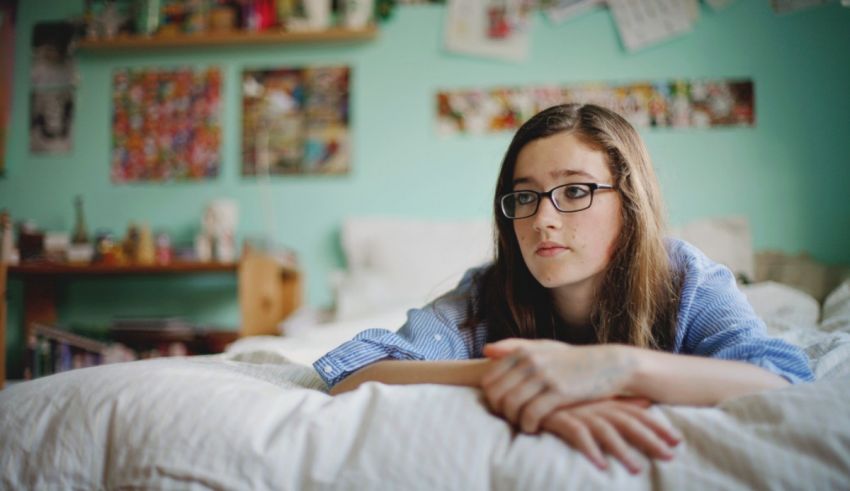 A woman lying on a bed.