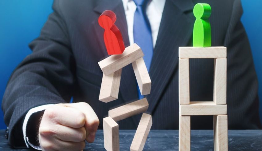 A businessman in a suit is pushing two wooden blocks against each other.