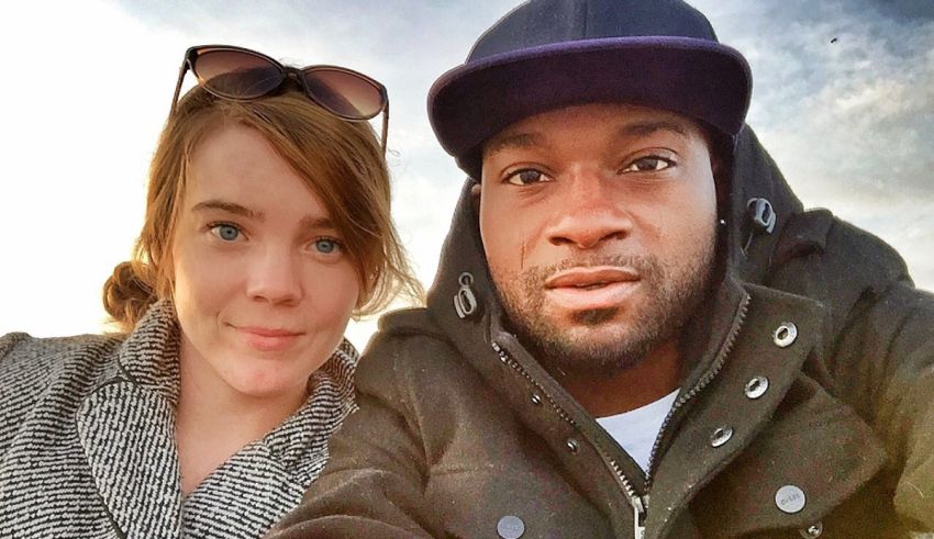 A man and a woman taking a selfie.