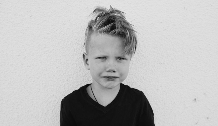 A black and white photo of a young boy.