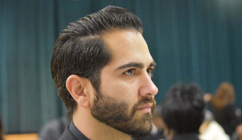 A man with a beard in a suit and tie.