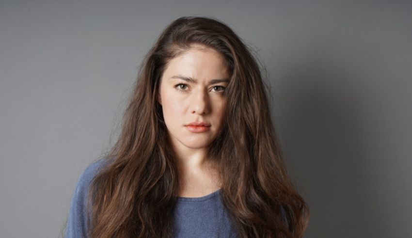 A young woman with long hair posing for a photo.