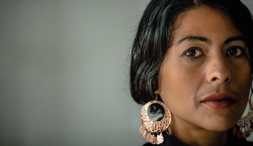 A woman wearing a large hoop earring.