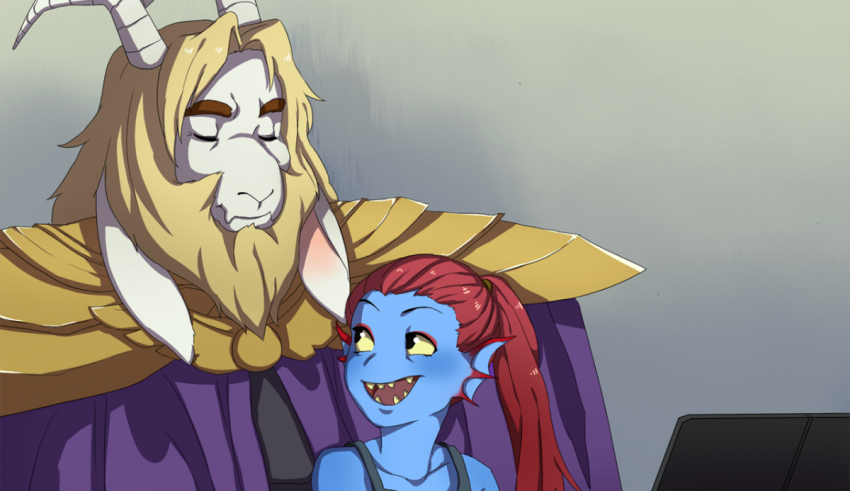 A girl and a demon sitting next to each other on a laptop.