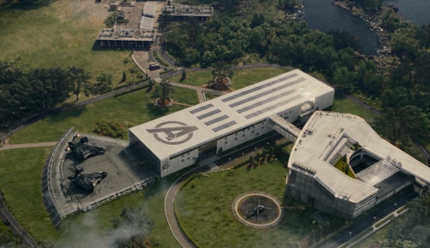An aerial view of a building near a lake.