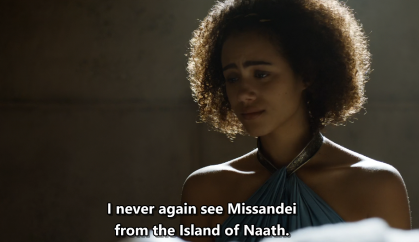 A woman in a dark room with the words never again see missandia from the island of nath.