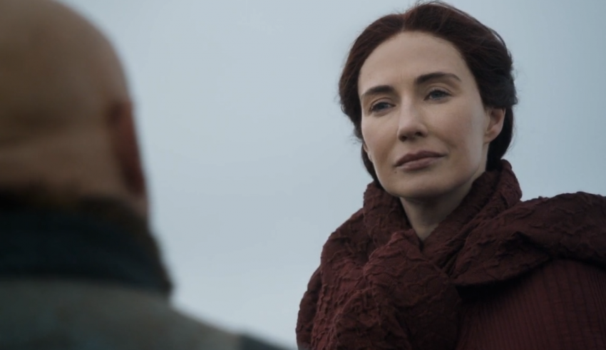 A woman in a red coat is looking at a man.