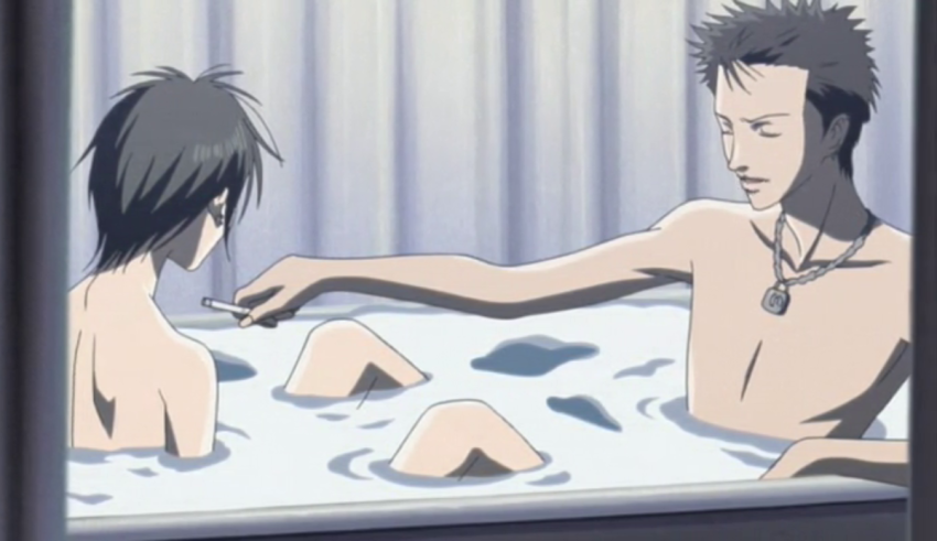 A man and a woman taking a bath in a bathtub.