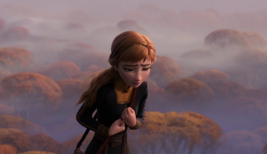 An image of a girl standing in a forest.