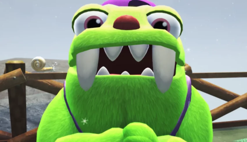 A green monster is standing next to a fence.