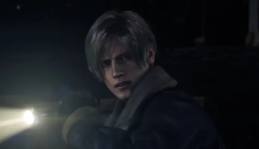 A man holding a flashlight in the dark.